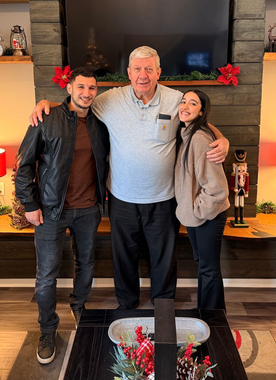 The Golden Hour Offers team with a homeowner on the day their sale closed
